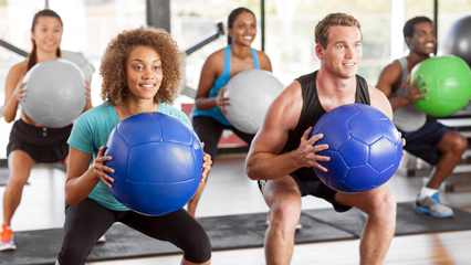 Group exercising with medicine balls