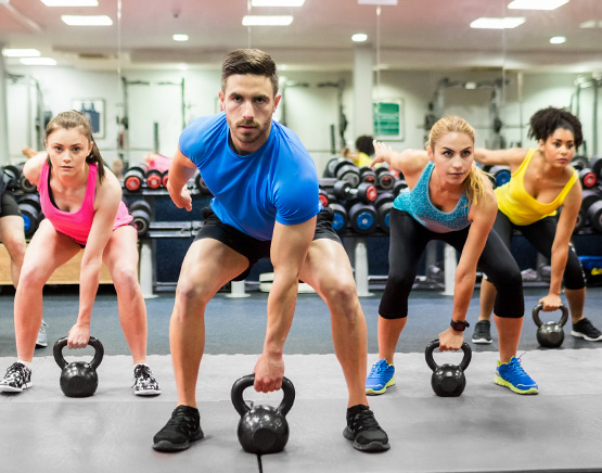 Group exercising with kettlebells