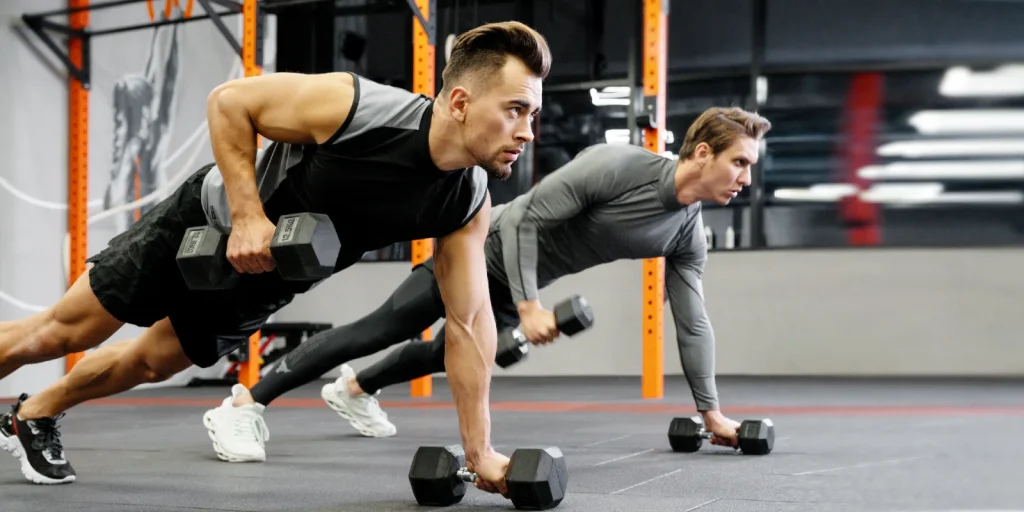 participants in a small group training class lifting weights