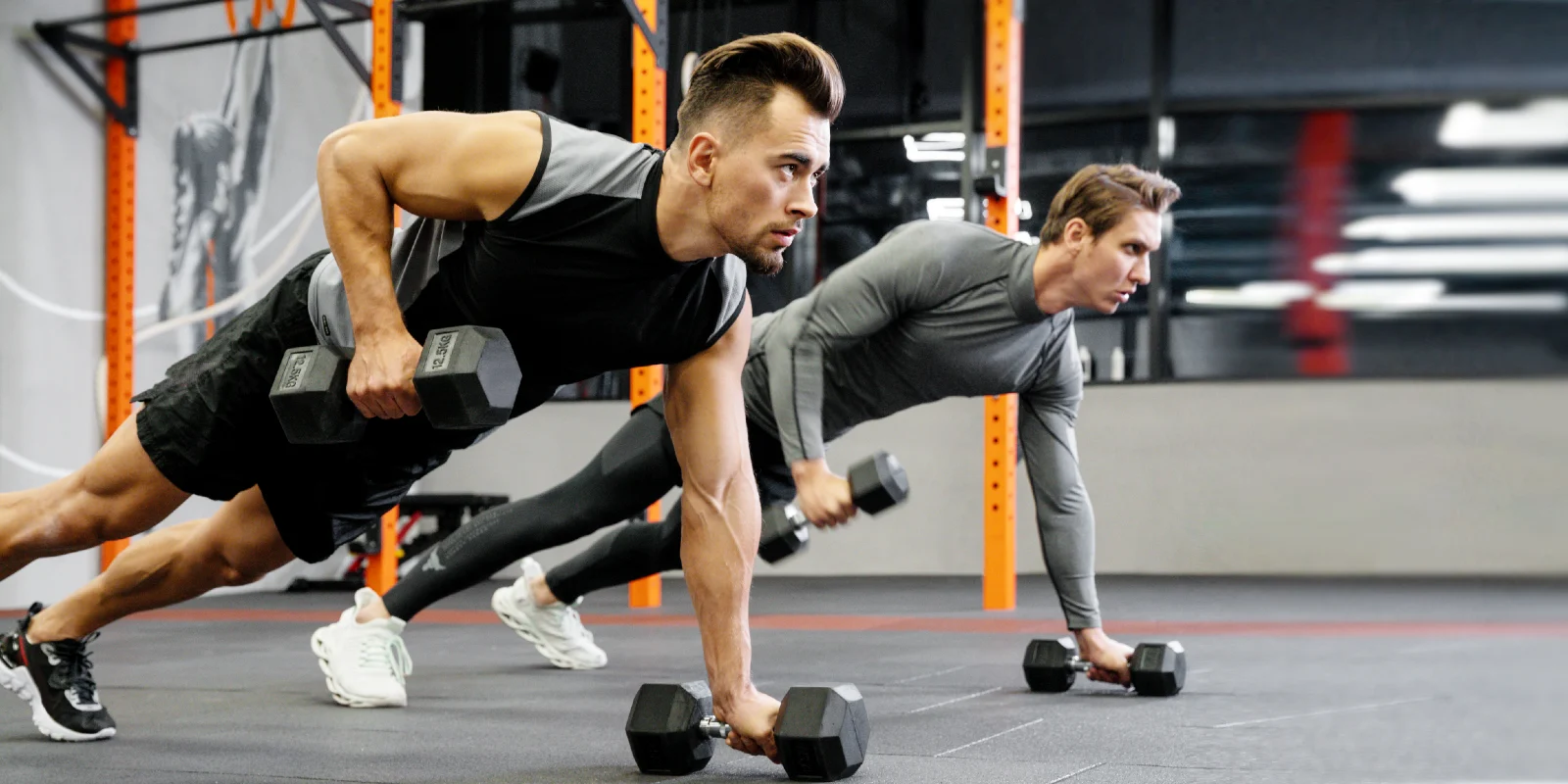 participants in a small group training class lifting weights