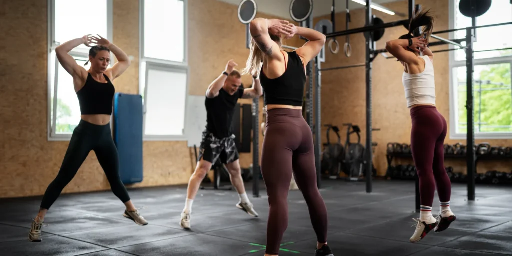 people working out together in a high intensity interval training group exercise class